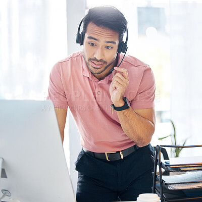 Buy stock photo Serious asian man, call center and computer in customer service or desktop support at office desk. Male consultant agent standing by PC in telemarketing advice or insurance with headset at workplace