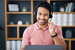 Asian man, call center and headset on laptop with smile for consulting, customer service or support at office. Happy male consultant with headphones by computer for telemarketing or online advice