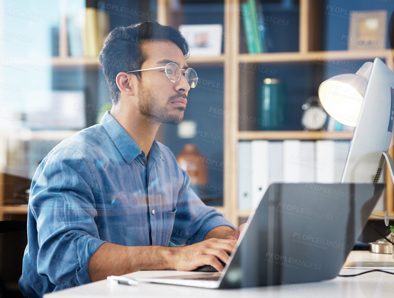 Buy stock photo Serious, business man typing on laptop, computer and software development, online research or information technology. App developer or asian person on digital multimedia and office glass reflection 