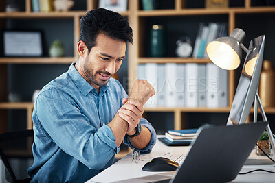 Buy stock photo Businessman working in the office with wrist pain, injury or accident medical emergency. Healthcare, professional and male employee sitting at his desk with sprain muscle in his hand in the workplace