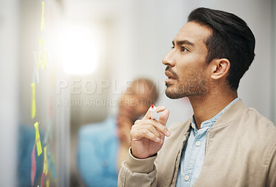 Buy stock photo Asian man, thinking and planning business schedule for project, tasks or brainstorming at the office. Thoughtful creative male with marker for idea strategy, decision or sticky note plan on board