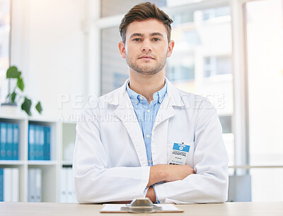 Buy stock photo Medical, serious and portrait of assertive doctor man in a hospital office feeling confident, focus and proud in clinic. Young medicine expert and healthcare professional with arms crossed for health