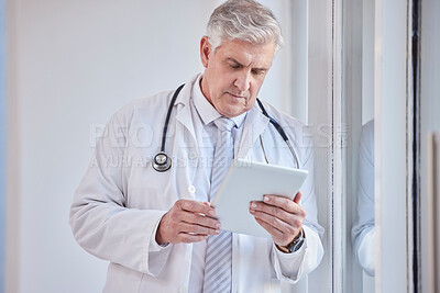 Buy stock photo Doctor, tablet and senior man in hospital for research, telehealth or online consultation. Healthcare, technology and elderly medical professional with touch screen for wellness app in health clinic.