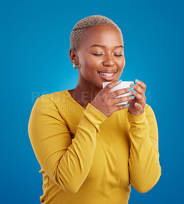 Buy stock photo Black woman, happy and coffee or tea smell in studio with a smile and happiness. African female model with a drink and hands on cup to relax with a positive mindset on blue background with beauty
