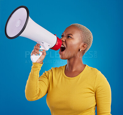 Buy stock photo Megaphone, shouting and angry black woman in studio for message, broadcast or vote on blue background. Speaker, microphone and girl protest for change, democracy and justice, noise and womens rights