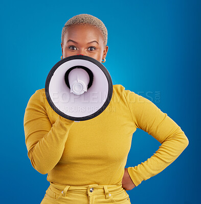 Buy stock photo Megaphone, protest and speaker with black woman in studio for change, democracy and opinion. Vote, announcement and message with female isolated on blue background for empowerment, strike and choice