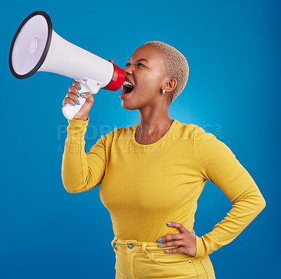 Buy stock photo Megaphone, angry and screaming black woman in studio for message, broadcast or vote on blue background. Speaker, microphone and girl protest for change, democracy and justice, noise and womens rights