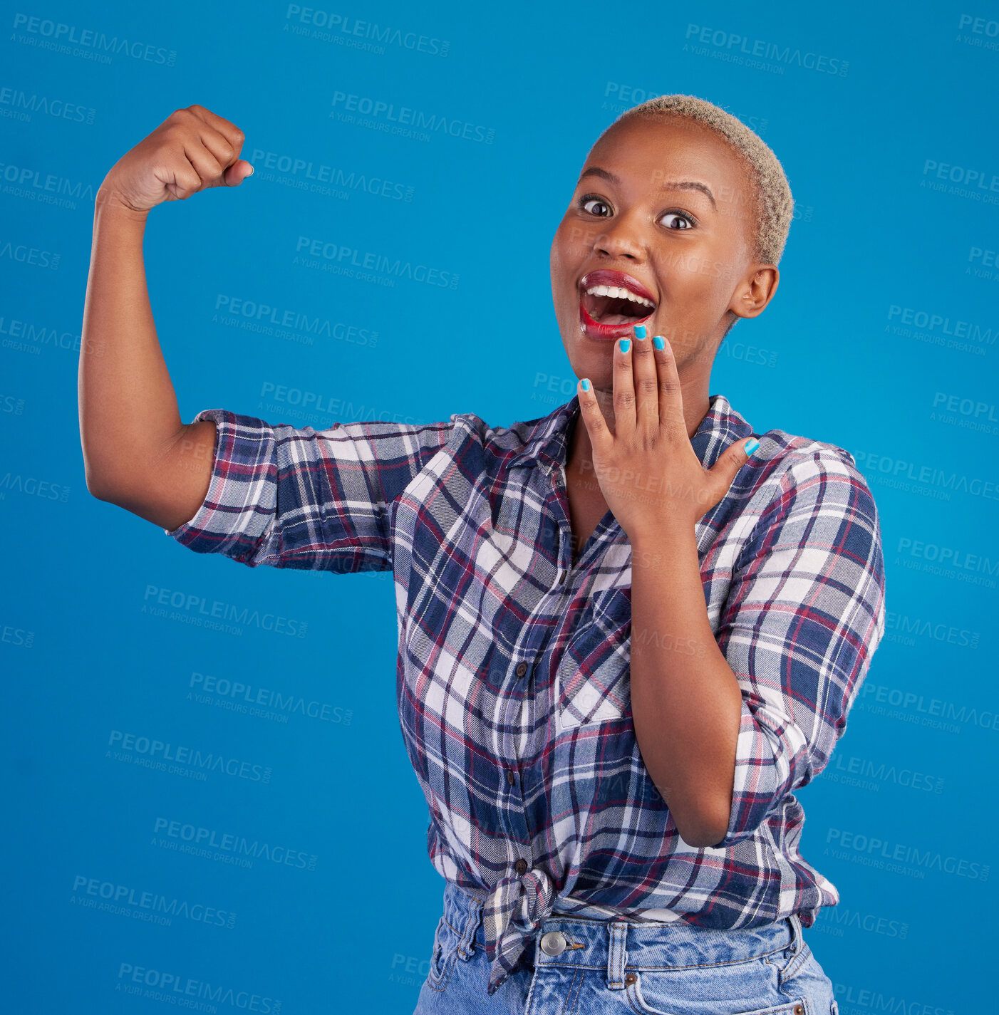 Buy stock photo Shocked, arm flex and portrait of black woman in studio for empowerment, confident or success. Achievement, hard work and pride with female isolated on blue background for power, strong or motivation