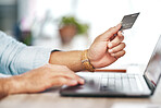 Man, hands and laptop with credit card for online shopping, ecommerce or wireless transaction on desk. Hand of male on computer for internet banking, app or financial purchase or payment on table