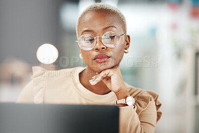Buy stock photo Office, laptop and black woman with glasses, thinking or reading email, online research or report. Computer, concentration and African journalist proofreading article for digital news website or blog