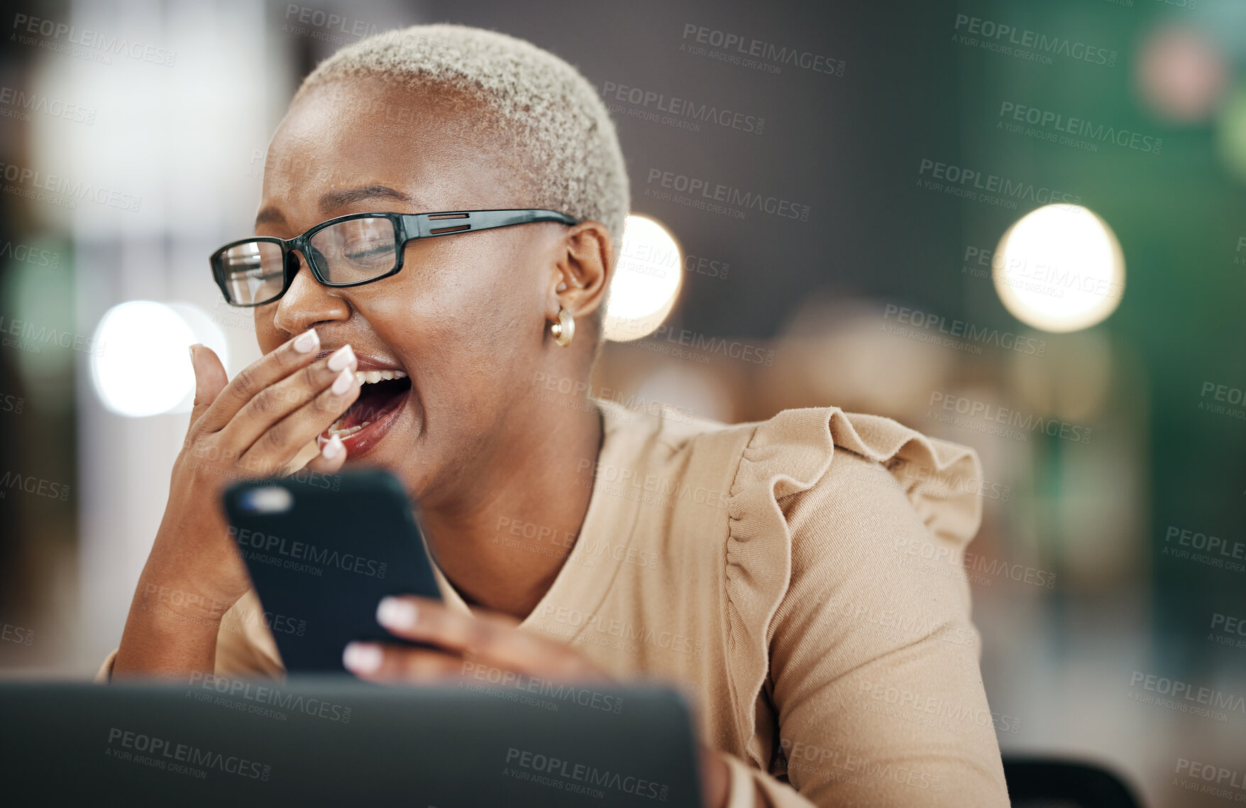 Buy stock photo Black woman laughing, phone and reading online post, social media or internet meme in office, workplace and night bokeh. Happy person with funny video, chat or networking on smartphone or cellphone