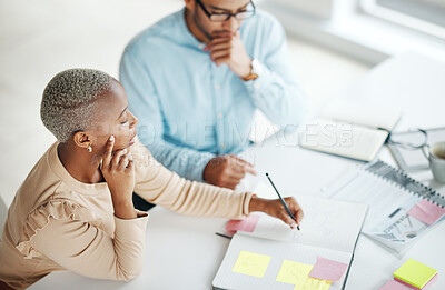 Buy stock photo Collaboration, strategy overhead and a business black woman at work with a man colleague in an office. Teamwork, planning and documents with professional people brainstorm thinking while working