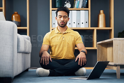 Buy stock photo Meditation, laptop and a yoga man breathing for mental health, wellness or zen on the floor of his home. Fitness, internet and virtual class with a male yogi in the living room to meditate for peace