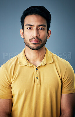 Buy stock photo Confidence, serious and portrait of a man in studio with depression, sadness or mental health problem. Tired, exhausted and Indian male model with burnout face expression isolated by gray background.