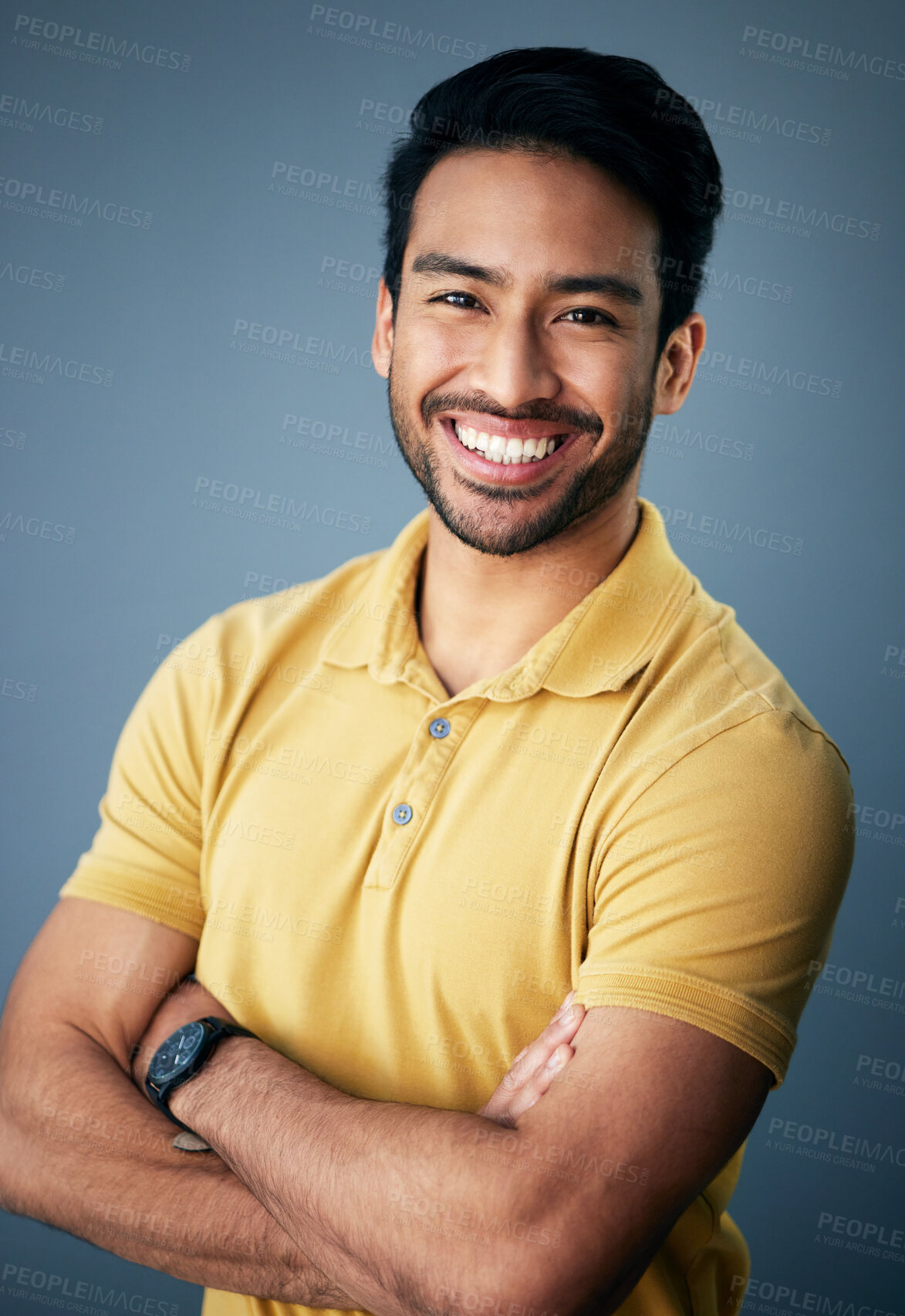 Buy stock photo Portrait, smile and Asian man with arms crossed, confidence and relax on a blue studio background. Face, Japanese male and guy with leadership, casual fashion outfit and success with joy and cheerful
