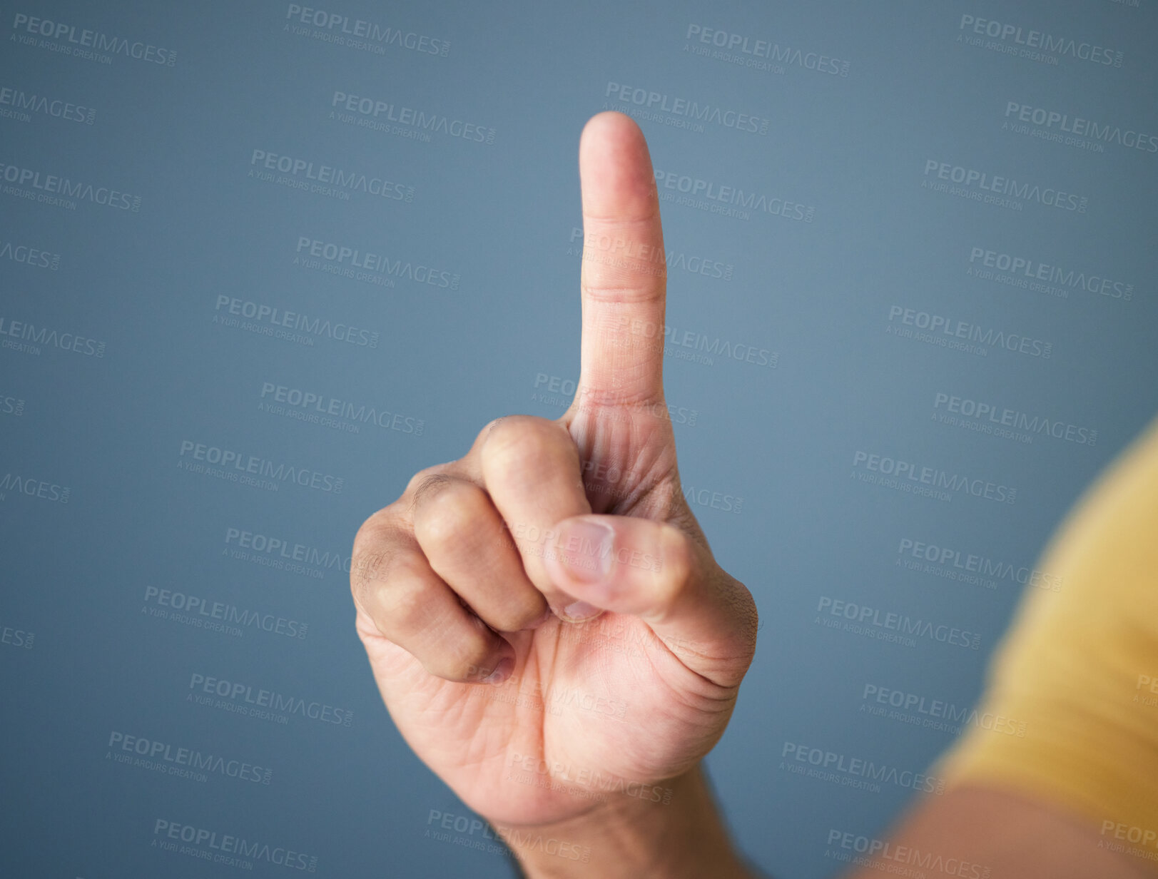 Buy stock photo Man, hand and pointing up in studio with mockup for question, choice or vote on blue background. Product placement, finger showing deal announcement or information with mock up space for notification