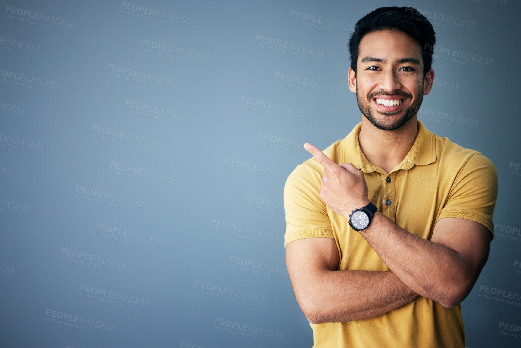 Buy stock photo Studio mockup, portrait and happy man pointing at promotion announcement, branding copy space or advertising. Smile, happiness and commercial person gesture at marketing mock up on blue background