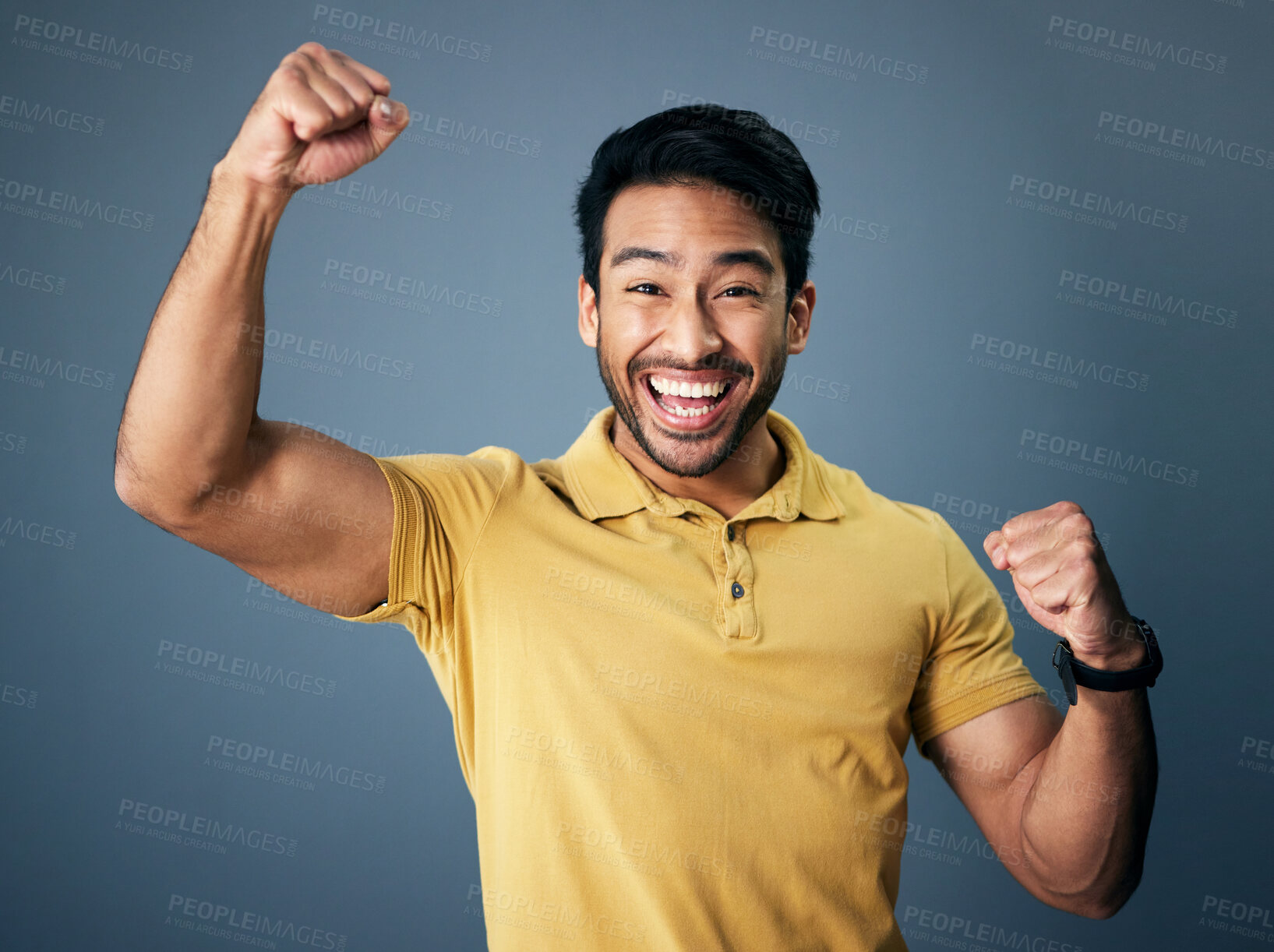 Buy stock photo Indian man, celebrate and fist in studio portrait for winning mindset, happiness or achievement by background. Young model, male student or celebration with happy, excited face or winning for success