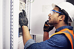 Man, phone call and engineering in control room, switchboard and power box inspection. Male electrician talking on smartphone at power box, server mechanic and electrical substation maintenance 