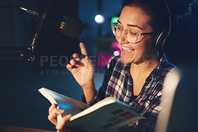 Buy stock photo Radio dj, presenter and woman in a sound production studio reading a book with happiness. Headphones, recording and working female employee with discussion on air for web podcast and books talk