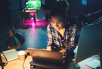 Buy stock photo Live streaming, computer and podcast woman typing news article, broadcast report or planning platform strategy at night. Journalist or person on laptop and microphone for student politics or radio