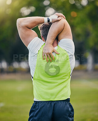 Buy stock photo Back, fitness and man stretching, training and outdoor for workout, exercise and sports for wellness. Male athlete, guy and player stretch arms, soccer and practice for competition, match and health