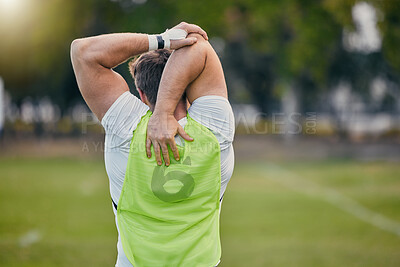 Buy stock photo Back, stretching and man training, fitness and exercise for balance, wellness and healthy lifestyle on field. Male athlete, guy and player outdoor, stretch and fitness for practice, workout or sports