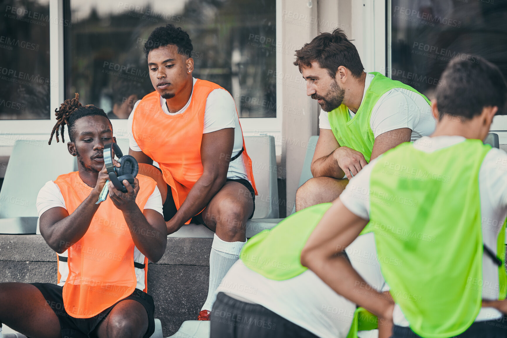 Buy stock photo Men, relax or rugby team with headphones on break, exercise workout or training for a game. Music, friends relaxing or sports people bonding, talking or resting after practice match on bench together