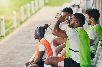 Buy stock photo Team, rugby men and fitness on bench with drinking water, relax or sitting with diversity, solidarity or health. Group teamwork, university or professional sports at stadium for game, friends or goal