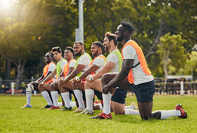 Buy stock photo Rugby sport, diversity and men training outdoor on a grass field with a team happy for knee exercise. Athlete group together for fitness, motivation and workout for sports club and strong teamwork