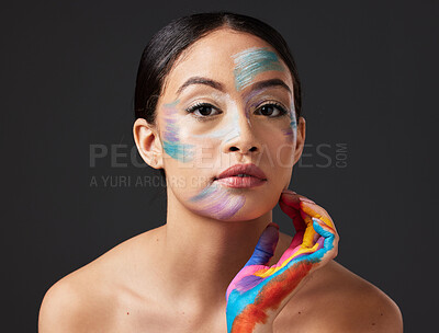 Buy stock photo Woman, face and beauty portrait with color paint art on hand in studio. Creative skin and makeup on female aesthetic model on gray background for lgbtq rainbow inspiration hands or facial cosmetics