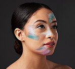 Beauty, art and portrait of woman paint on face, creative makeup and self expression. Skincare, creativity and color in artistic cosmetics, empowerment and freedom to express for young beautiful girl