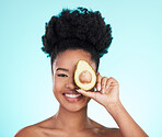 Avocado, happy skincare and woman portrait of beauty, wellness and detox healthcare. Isolated, blue background and studio with a young female smile from healthy fruit food with vitamin for glow