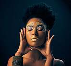 Beauty, gold and metallic with black woman and makeup in studio for luxury, cosmetics and African pride. Natural, creative and goddess with female model on background for queen, bronze and glamour