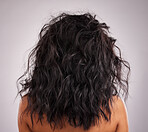 Beauty, crazy hair and closeup of a woman back with healthy and wellness of a hairstyle texture. Salon, beautiful curls and wavy haircut textures of a female with dark color beautician treatment