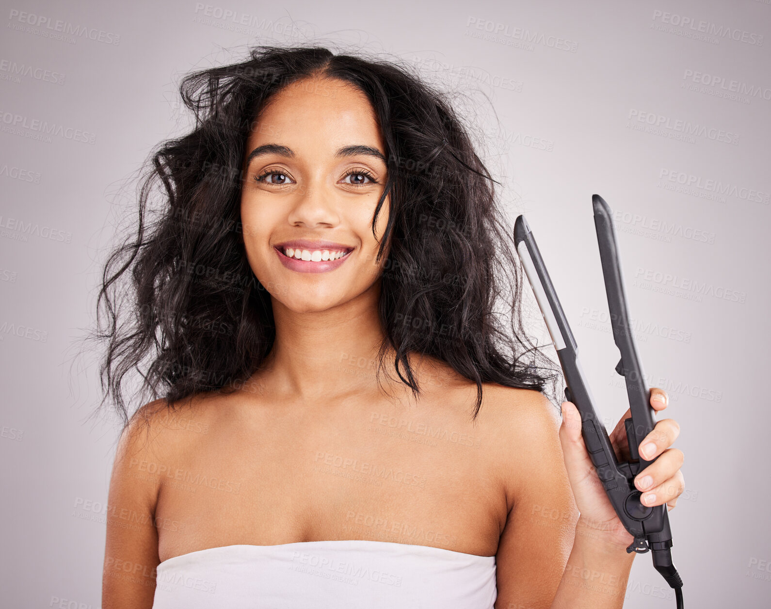 Buy stock photo Portrait, happy woman and hair straightener for beauty in studio, transformation or smile on background. Female model, haircare and heat styling equipment of ironing curly hairstyle, texture or tools