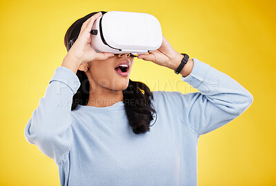 Buy stock photo Woman with VR goggles, surprise and experience in metaverse, digital world and futuristic on yellow studio background. Virtual reality, technology and UX, wow expression and cyber space with gaming