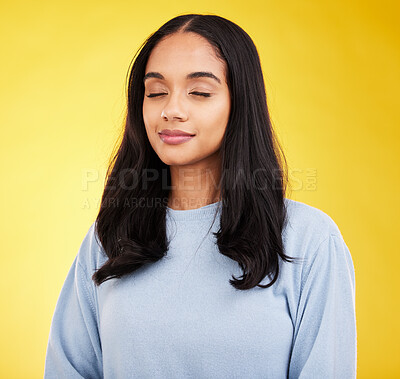 Buy stock photo Indian woman with eyes closed, meditation and zen with peace and calm isolated on yellow studio background. Mental health, wellness and balance with stress relief, young female relax with mindfulness