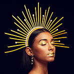 Crown, gold makeup and an elegant queen isolated on a black background in a studio. Dreaming. ethereal and an Indian girl with cosmetics, accessories and jewelry for royalty on a dark backdrop