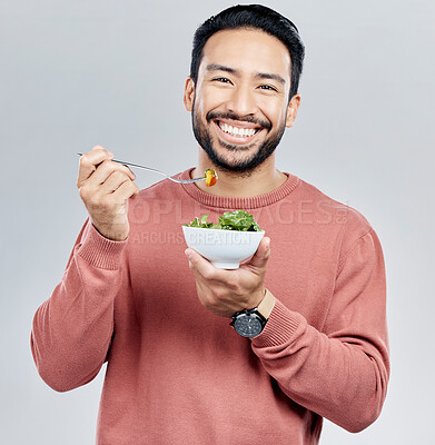 Buy stock photo Man, salad and eating healthy portrait in studio for wellness food motivation with vegetables. Asian male smile for vegetable nutrition, diet and benefit for digestion or lose weight white background