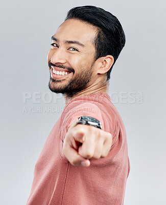 Buy stock photo Pointing, happy and smile with portrait of man in studio for thank you, motivation and amazing. Winner, confident and friendly with male on white background for yes, achievement and satisfaction