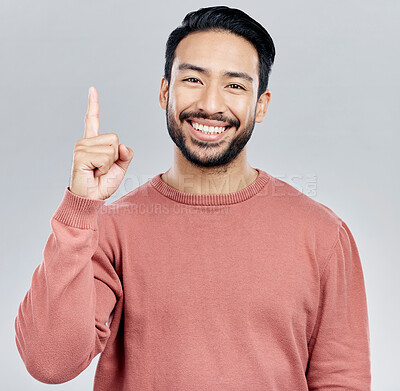 Buy stock photo Smile, space and portrait of Indian man pointing up, mockup and product placement isolated on white background. Promotion, information and person showing deal announcement in studio with launch idea.