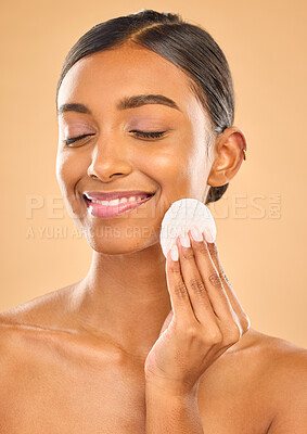 Buy stock photo Skin, beauty and face cotton of woman in studio for cosmetics, dermatology or makeup. Aesthetic female 
hand with product for self care, remove makeup and natural facial results on a brown background