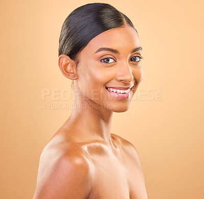Buy stock photo Smile, glowing and portrait skincare of a woman isolated on a studio background. Happy, beautiful and an Indian model with a glow from cosmetics, healthy skin and smooth complexion on a backdrop