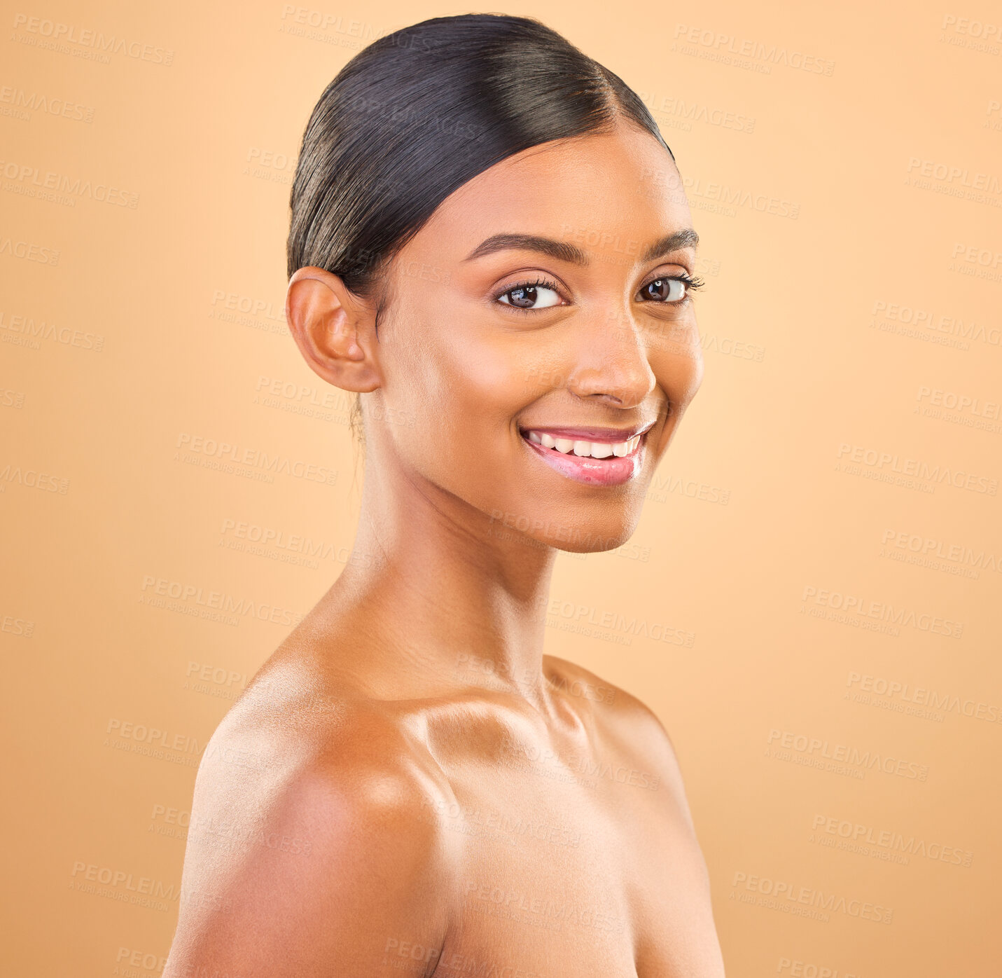 Buy stock photo Smile, glowing and portrait skincare of a woman isolated on a studio background. Happy, beautiful and an Indian model with a glow from cosmetics, healthy skin and smooth complexion on a backdrop