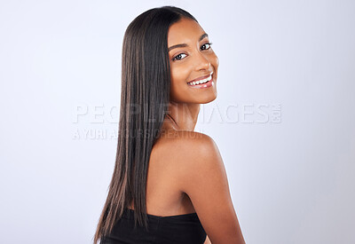 Buy stock photo Portrait, beauty and Indian woman with hair care, texture and happiness against grey studio background. Face, female and lady with cosmetics, luxury and salon treatment for shine, glow and self care