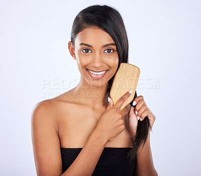 Buy stock photo Woman, portrait smile and brush for grooming, haircare salon or keratin treatment against a white studio background. Happy isolated female beauty model smiling and brushing straight long hairstyle