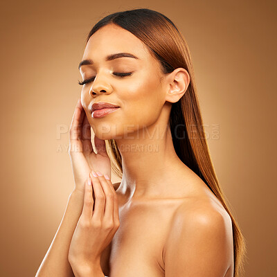 Buy stock photo Woman with hand on face, hair and skincare with bronze glow and luxury salon treatment on brown background. Beauty, makeup and skin care cosmetics, hispanic model with straight hairstyle in studio.