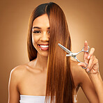 Hair care, beauty and portrait of woman with scissors and smile for luxury salon treatment on brown background. Beauty, haircut and split ends, happy hispanic model with straight hairstyle in studio.