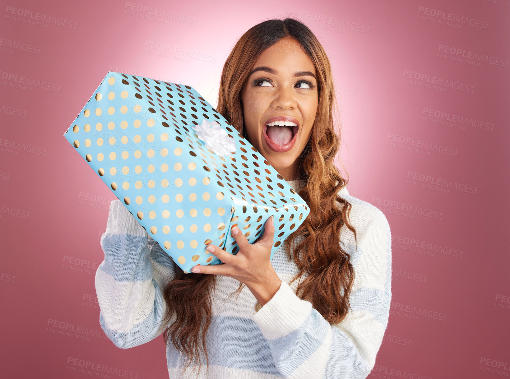 Buy stock photo Woman, gift box and studio with thinking, happiness and surprise celebration by gradient background. Student girl, young and happy with present package, excited face and celebrate birthday with smile